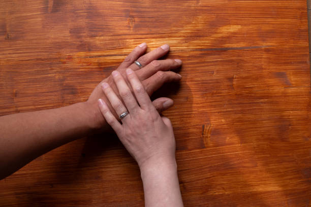 istock man and woman wearing wedding rings 1941994510