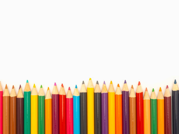 istock Colorful colored pencils on a white background in a creative workspace. 1941997974