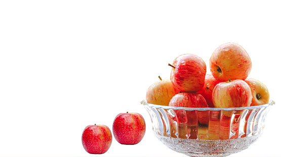 Fresh Red Apples in a glass container isolated on white background. Copy space for text