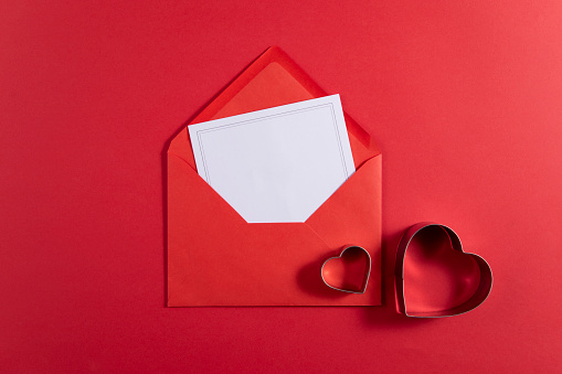 Red envelope and empty greeting card on red background