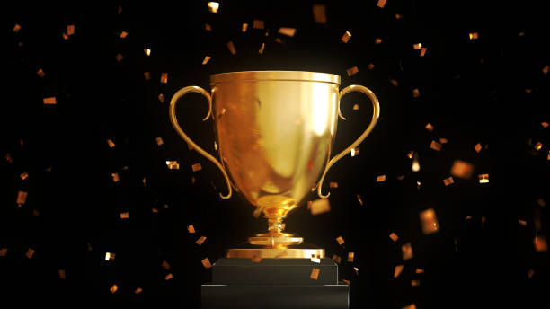 istock Gold confetti and 3D trophies 1942055262