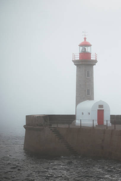 istock lighthouse in Oporto in cloudy day 1942058069