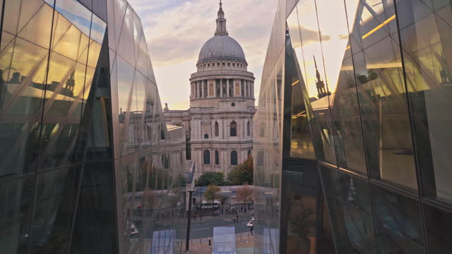 Elevated view of St. Paul's Cathedral  and modern building department store with tourist people walking in the central City of London, United Kingdom