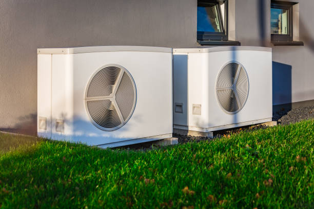 istock Two air source heat pumps installed outside of a modern house 1942101552