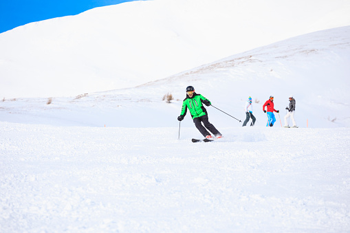 Winter sport group,  Vital senior two men  and two women best friends.  Snow skier, skiing  enjoying on sunny ski resorts.  Snowcapped mountain  Dolomite super ski area. Ski resort. italy, Europe.