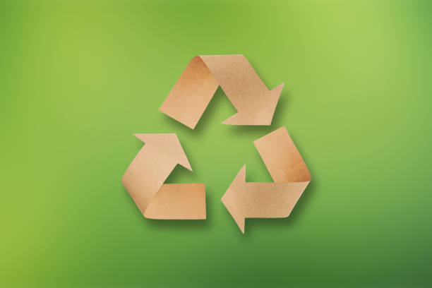 istock Recycle symbol made of cardboard paper. Refuse reuse recycle concept. 1942117203