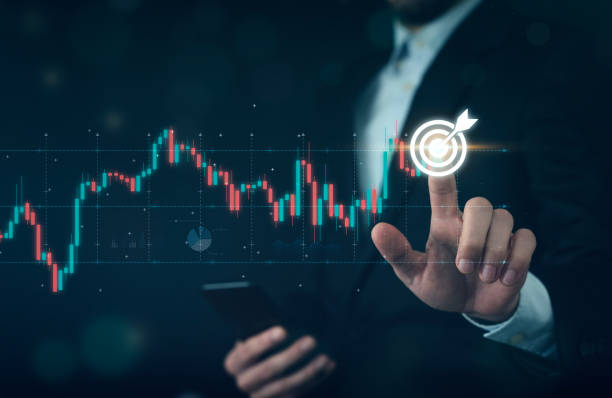 istock Businessman pointing arrow graph and chart 1942145425