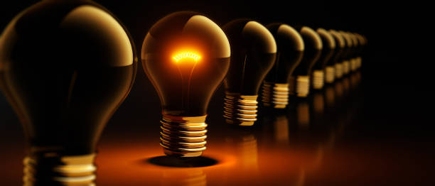 istock Row of standing light bulbs 1942180712
