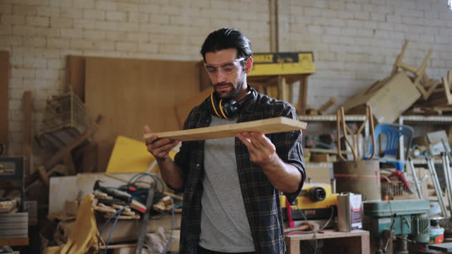 Handsome Carpenter in workshop.