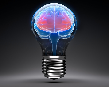 Luminous Light Bulb in Shape of a human Brain on dark Background