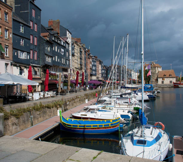 Honfleur, harbor basin with half-timbered houses and fishing boats