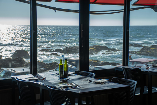gourmet restaurant with a table prepared to welcome tourists facing the sea on the Chilean coast