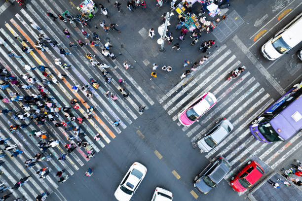 istock A Bustling City Intersection Captured From Above With Pedestrians Crossing in Multiple Directions 1942239788