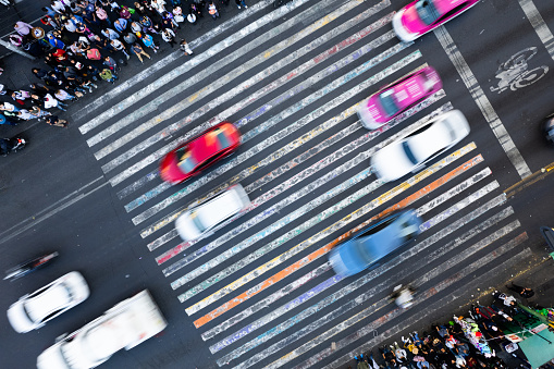 A Bustling City Intersection Captured From Above With Pedestrians Crossing in Multiple Directions