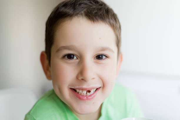 istock Happy smiling caucasian boy drink milk 1942249498
