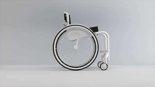 istock White Wheelchair on a Soft Gray Studio Background. Medicine concept. Perspective view. Monochrome. Right Side View. 1942254940