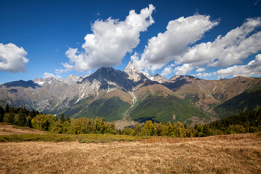 Autumn image of the mountains of Svaneti and the snow-capped peaks of the Caucasus