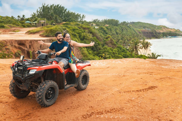 istock Couple on quad bikes in nature 1942284479