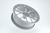 Gray Racing Rim on a White Studio Background. Minimal concept. Perspective view. Monochrome.