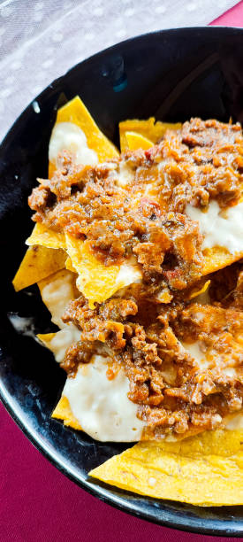 istock Nachos topped with Bolognese and sour cream. 1942306882