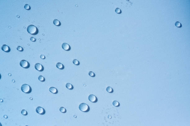 Blue transparent water drops, cosmetic texture. Moisturising cosmetics concept, spa texture. Skincare spray