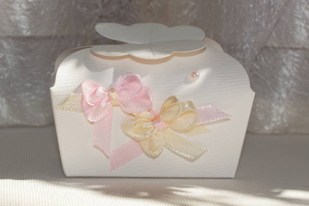 istock Ivory bonbonniere with sweets for wedding guests 1942357520