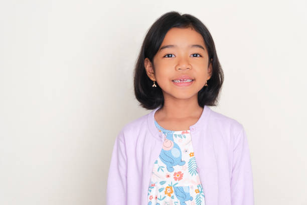 Asian kid smiling friendly at the camera