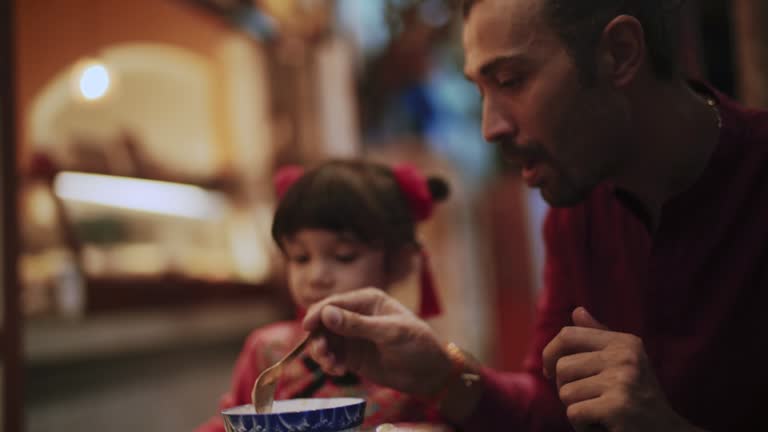 Father and daughter in a restaurant