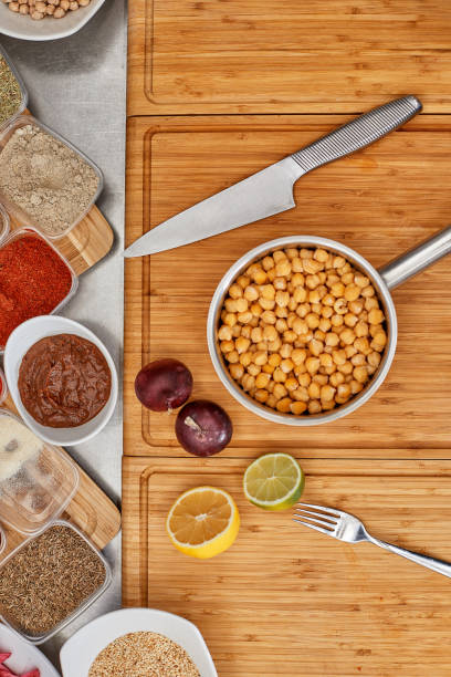 Many different spices, vegetables and ingredients, and fresh herbs for making homemade sauce