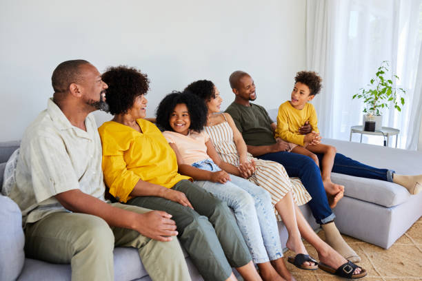 istock Smiling multi-generation family talking on a sofa during a visit together 1942451652