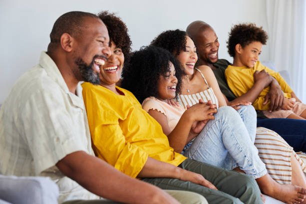istock Laughing multi-generation family watching television together 1942452763