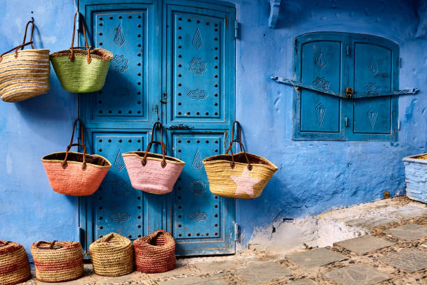 Street store with colourful handmade baskets in Chefchaouen, Morocco, Street store with colourful handmade baskets in Chefchaouen, Morocco, Africa. fashion bazaar stock pictures, royalty-free photos & images