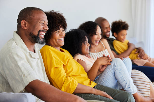 istock Laughing multi-generation family watching television on their sofa 1942453824
