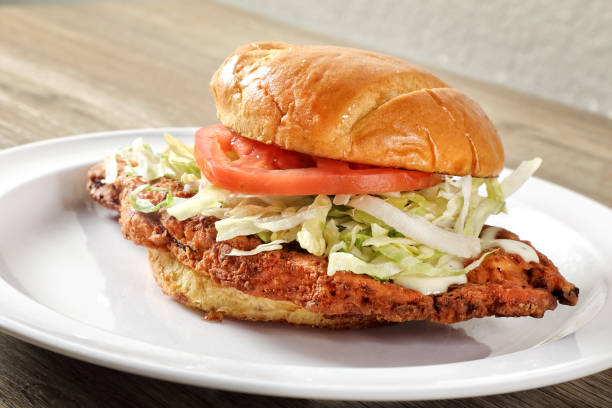 istock Chicken Burger plate on wooden table 1942456453