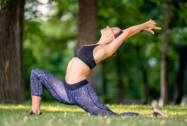 istock Girl doing yoga at nature 1942466492
