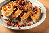 Close up waffle with bacon breakfast dish on wooden table
