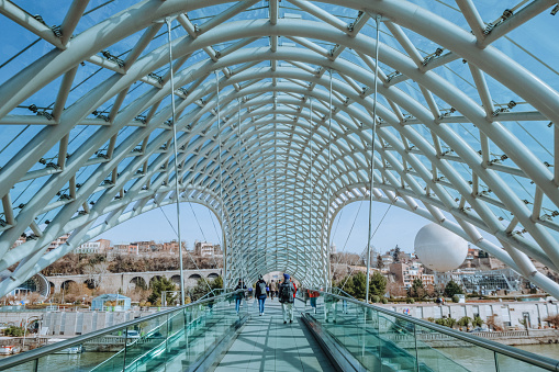 Bridge of Peace, a tourist attraction in the middle of the city Bridge over the beautiful river of Tbilisi in Georgia.