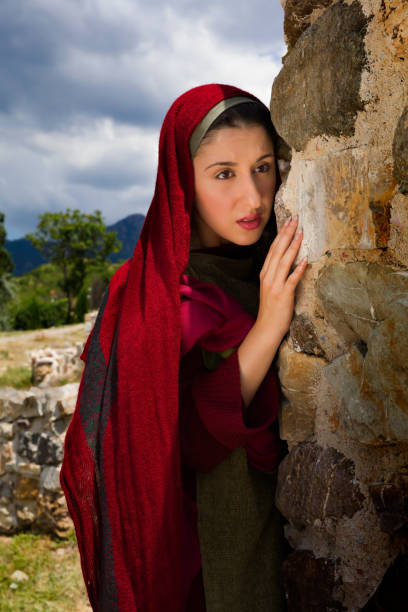 Mary Magdalene at Jesus' grave Mary Magdalene standing at the entrance of the empty tomb of Jesus on Easter morning tomb of the virgin mary in jerusalem stock pictures, royalty-free photos & images