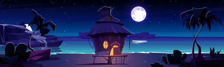 Small house with straw roof and light from window and door on sandy sea or ocean beach at night. Cartoon vector landscape of midnight dark coast with palm trees and rocks in water under moonlight.