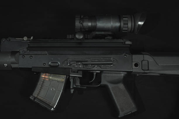 istock AKM assault rifle with night vision device, close-up photo. 1942506812