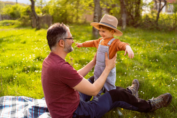 istock Father and son having fun time in nature 1942529946