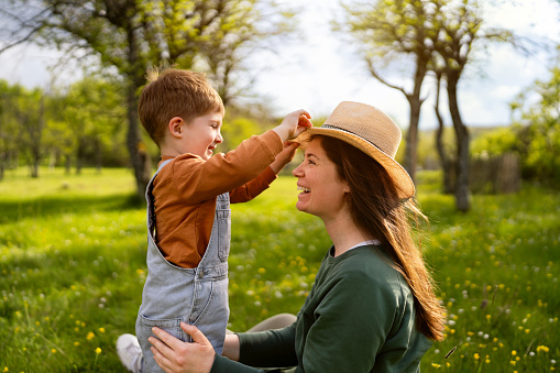 Happy mother's day. Child daughter congratulating her mother and giving her bouquet of flowers.