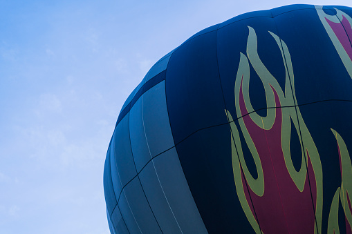 A blast of gas ignites, filling a hot air balloon with warm air on a cold winter's morning in Hunter Valley, New South Wales, Australia