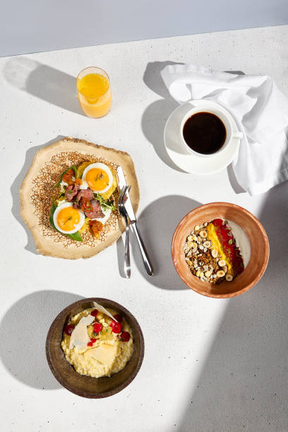 istock Top view of a breakfast spread with potato pancakes, roast beef, and eggs, complemented by coffee and orange juice 1942544902