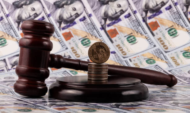 istock Judge's gavel and US dollars 1942545945