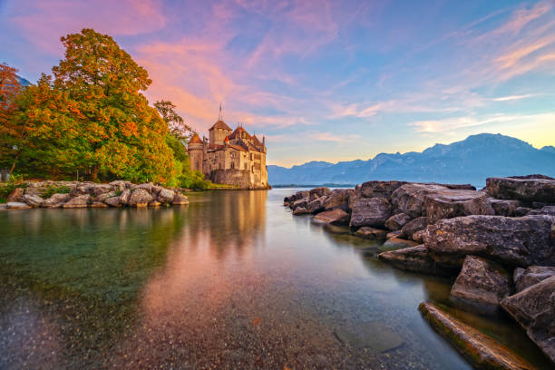 Veytaux, Switzerland - October 6, 2013: Chillon Castle on Lake Geneva at dusk. It is amongst the most visited medieval castles in Switzerland.