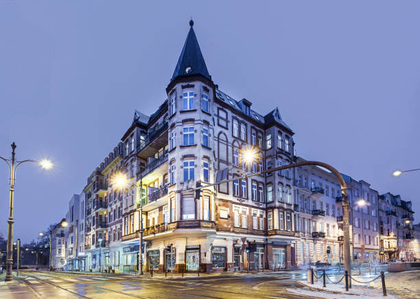 Urban architecture. A stylish tenement house in the city center at night.