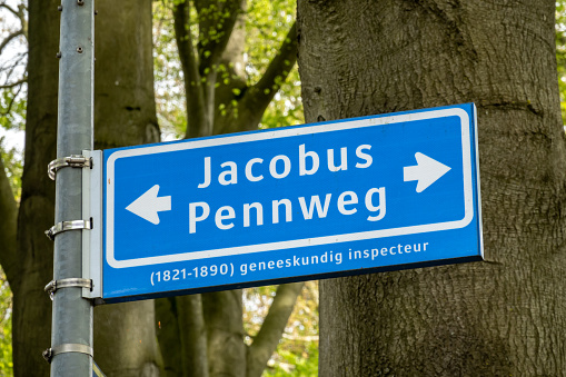 Blue street name sign of Jacobus Pennweg, named after health inspector, in Hilversum, Netherlands