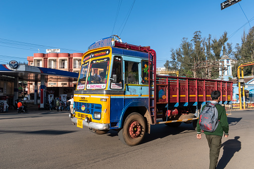 Ooty, Tamil Nadu, India - October 28 2023: A colourfully painted TATA truck transporting goods.