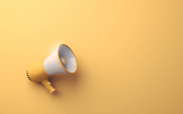 istock Yellow & White Megaphone on Soft Yellow Background 1942627379